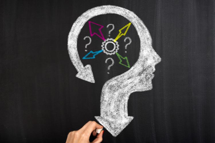 Thoughts and options head with arrows on blackboard